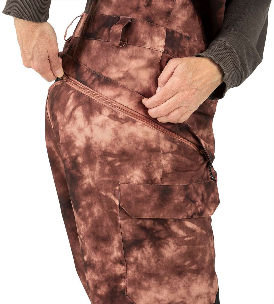 Volcom Women's Creston 3D Stretch Bib Pant 2024 - Brown bib pant with a subtle floral pattern on the side pockets and belt loops.