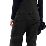 Volcom Women's Creston 3D Stretch Bib Pant - Black bib pant with white logo on left thigh and adjustable Velcro straps at waist.