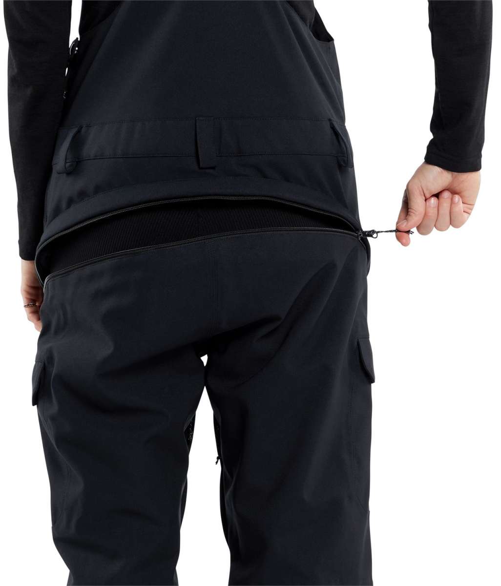 Volcom Women's Creston 3D Stretch Bib Pant - Black bib pant with a subtle pattern of small, dark gray dots on the upper thigh area.