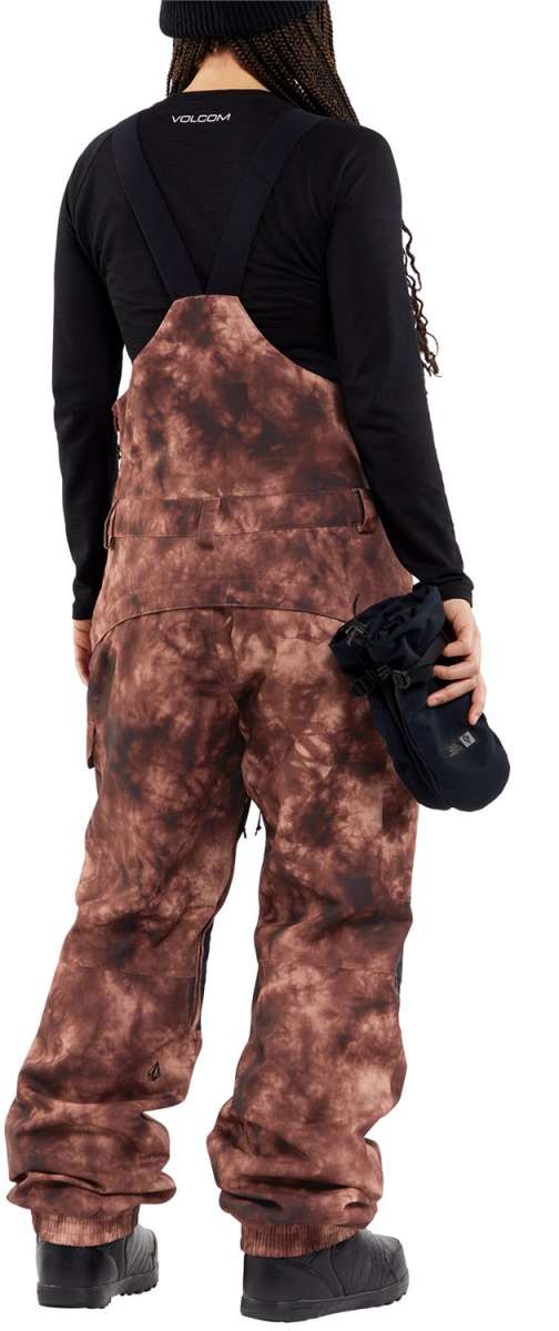 Volcom Women's Creston 3D Stretch Bib Pant - Brown bib pants with a subtle tie-dye pattern and black accents on the side pockets.