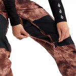 Volcom Women's Creston 3D Stretch Bib Pant - Black bib pant with a subtle pattern of thin white lines on black fabric.