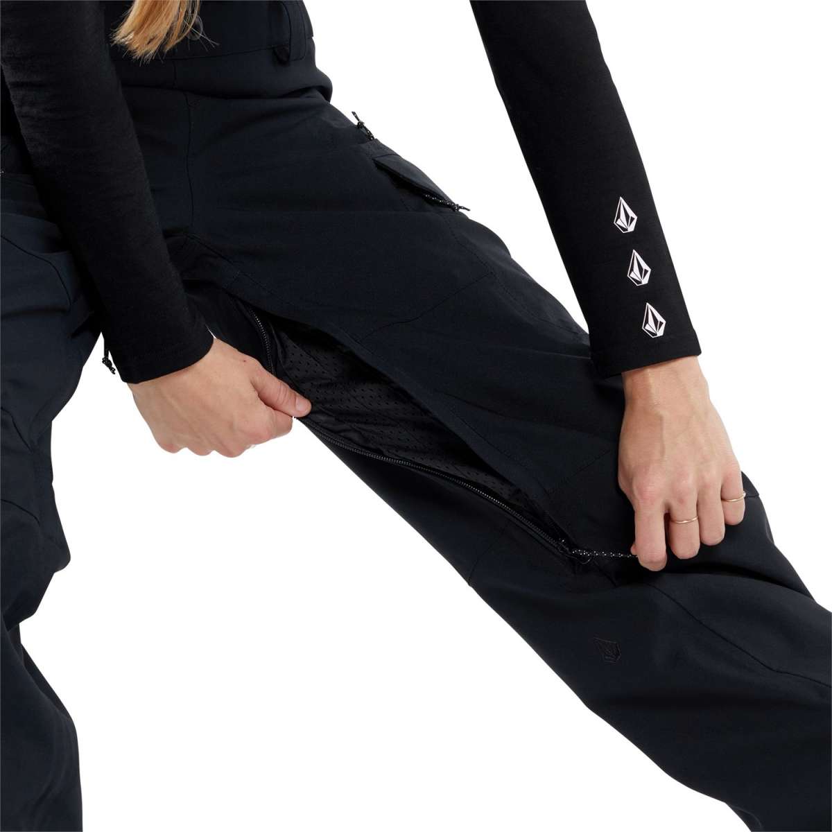 Volcom Women's Creston 3D Stretch Bib Pant - Black bib pant with white logo on left thigh and black zipper fly.