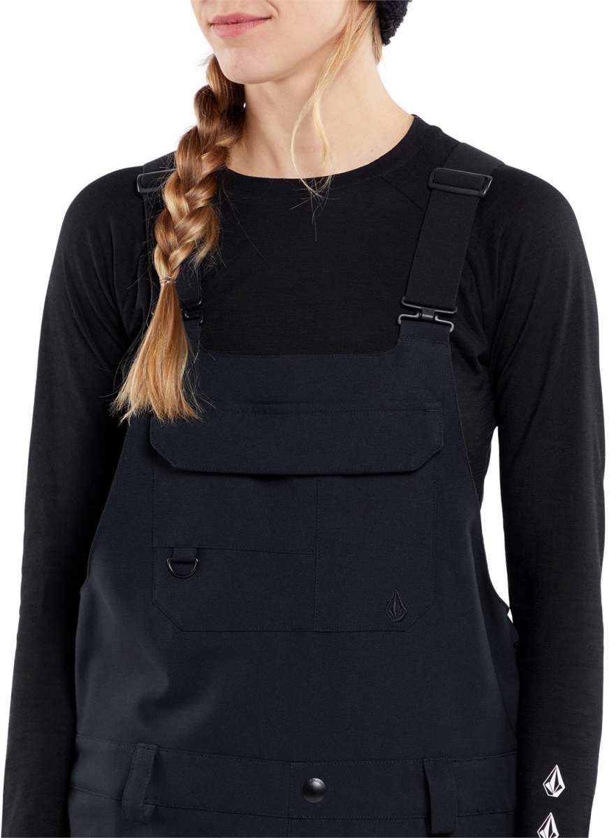 Volcom Women's Creston 3D Stretch Bib Pant - Black bib pants with a subtle pattern of thin white lines on the upper thigh area.