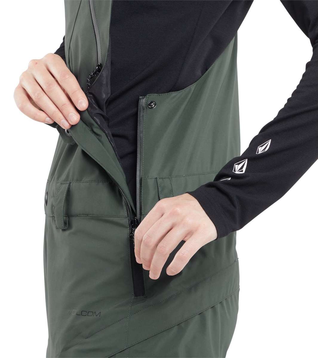 Volcom Women's Elm Stretch GORE-TEX Bib Pant 2024 - A dark green bib pant with a black zipper and logo on the left thigh.