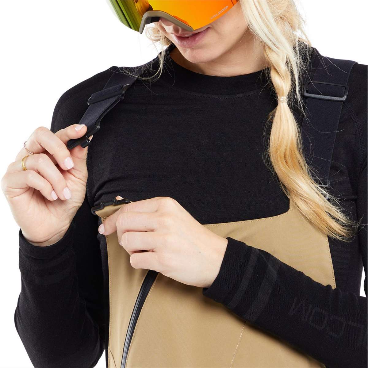 Volcom Women's Elm Stretch GORE-TEX Bib Pant - A pair of tan snow pants with a black strap and buckle on the side.