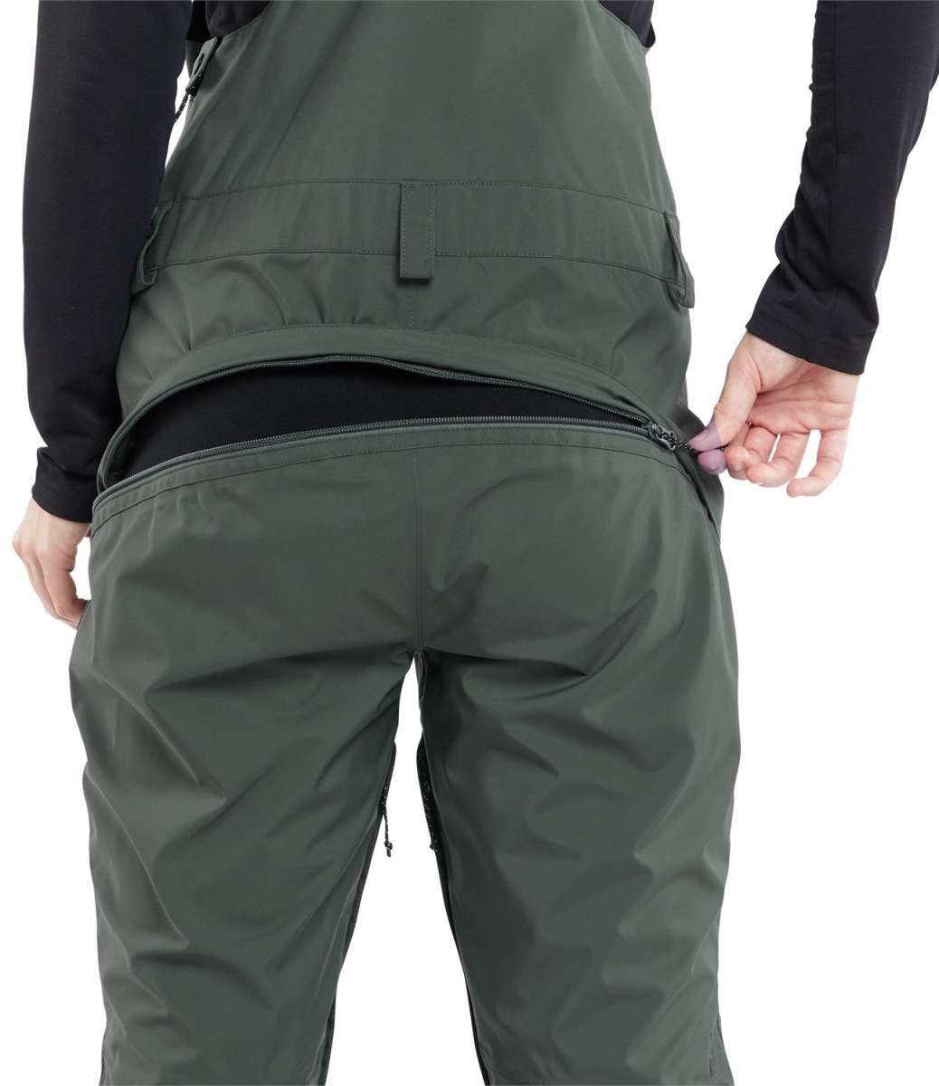 Volcom Women's Elm Stretch GORE-TEX Bib Pant 2024 - Dark green bib pant with black zippers and adjustable cuffs.