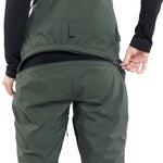 Volcom Women's Elm Stretch GORE-TEX Bib Pant 2024 - Dark green bib pant with black zippers and adjustable cuffs.
