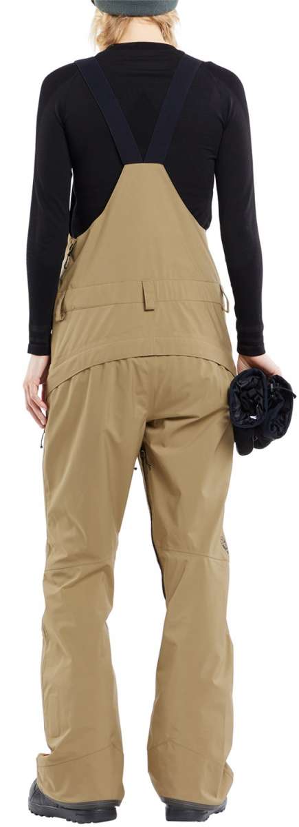Volcom Women's Elm Stretch GORE-TEX Bib Pant - Black bib with tan stretch fabric and black straps, featuring a zippered fly and two front pockets.