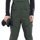 Volcom Women's Elm Stretch GORE-TEX Bib Pant - Dark green bib pant with black zippers and adjustable straps on shoulders.