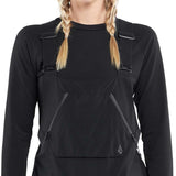 Volcom Women's Elm Stretch GORE-TEX Bib Pant - Black bib pant with diagonal white and grey stripe pattern on left leg, zippered ankle pocket, and adjustable straps.