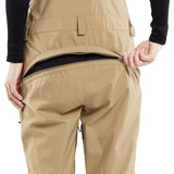 Volcom Women's Elm Stretch GORE-TEX Bib Pant 2024 - Beige bib pant with a black logo on the left thigh and adjustable Velcro straps at the waist.
