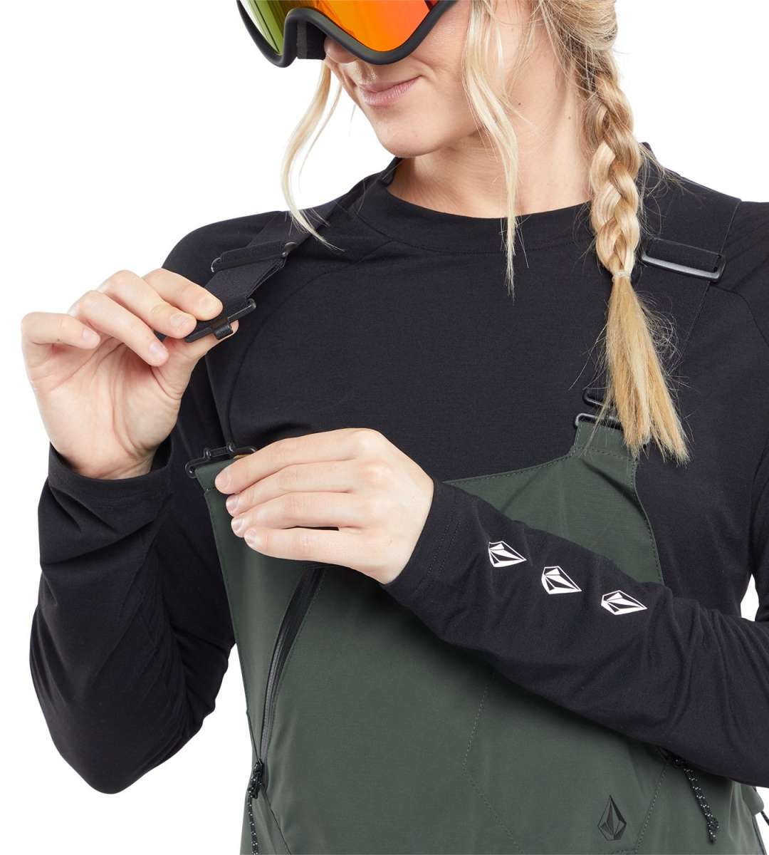 Volcom Women's Elm Stretch GORE-TEX Bib Pant - A pair of dark green snow pants with a black logo on the left thigh and adjustable straps at the shoulders.