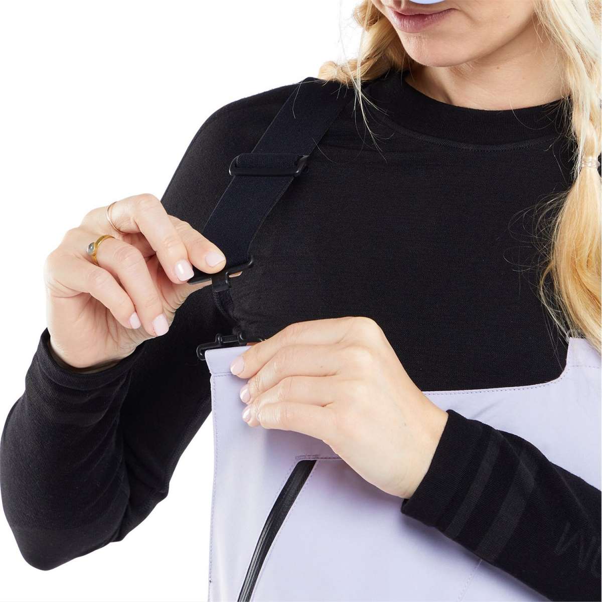 Volcom Women's Elm Stretch GORE-TEX Bib Pant - A pair of bib pants with a light purple color and black zippers on the side.