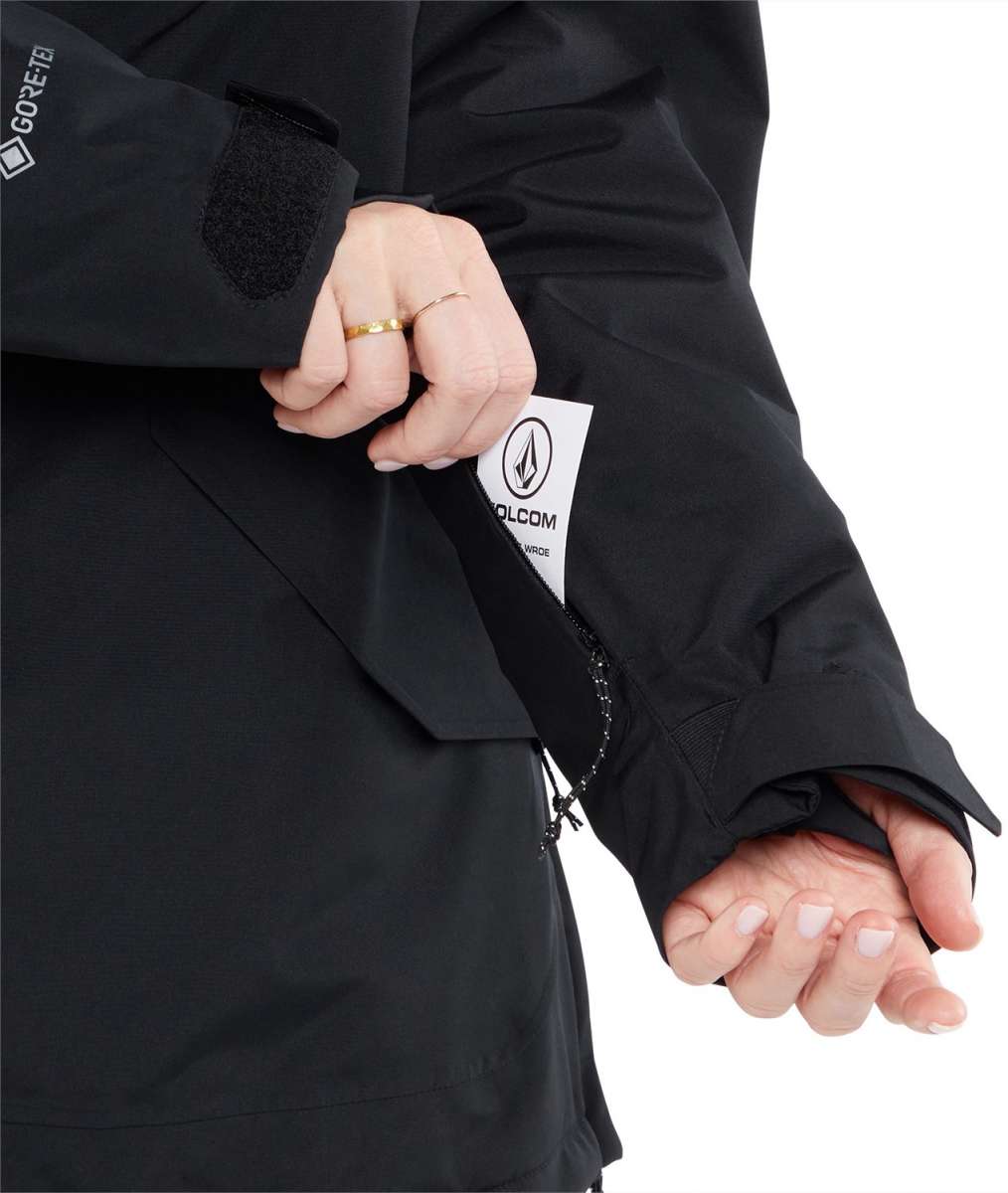 Volcom Women's Fern Insulated GORE-TEX Pullover 2024 - A black insulated jacket with a white logo on the left chest and a zipper closure.