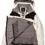 Volcom Women's Fern Insulated GORE-TEX Pullover 2024 - A black and white insulated jacket with a hood, featuring a zipper closure and two pockets on the front.