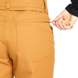 Volcom Women's Hallen Shell Pant 2023 - A pair of khaki-colored snow pants with a zippered pocket on the side.