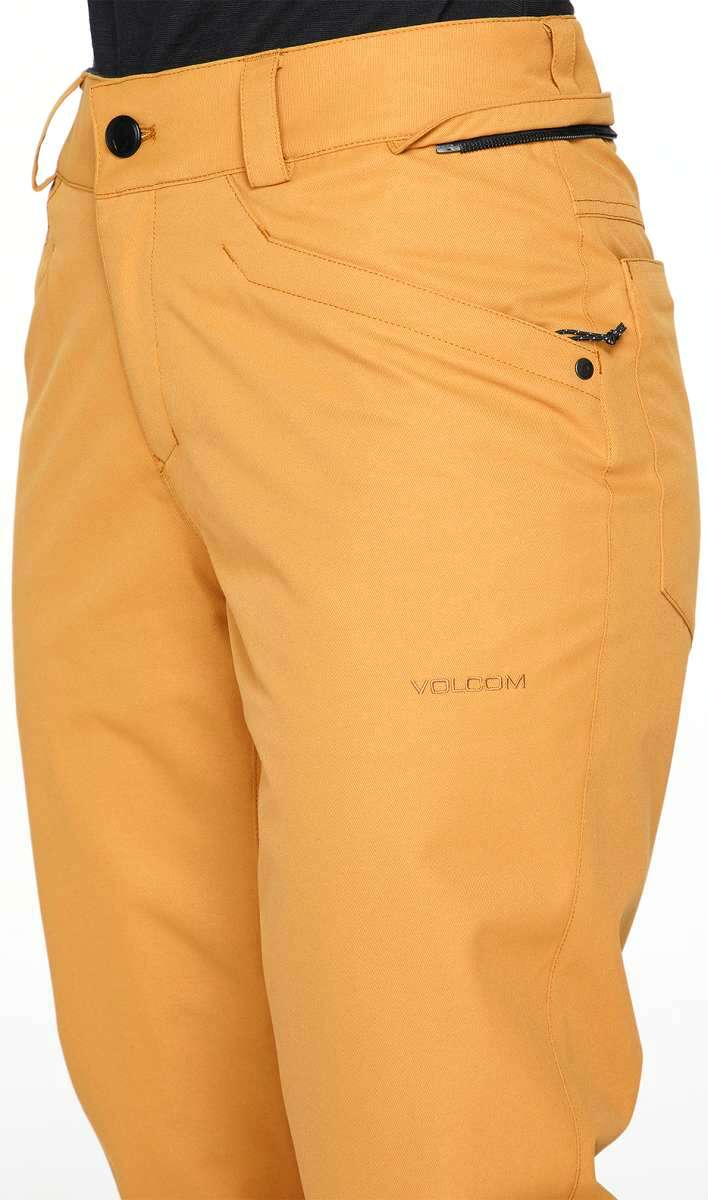 Volcom Women's Hallen Shell Pant 2023 - A pair of khaki-colored snow pants with a black zipper on the back pocket.