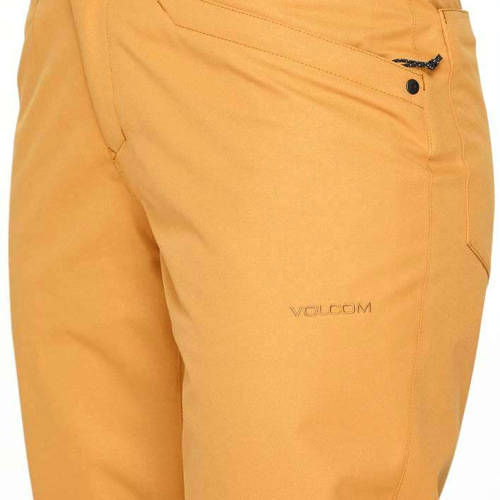 Volcom Women's Hallen Shell Pant 2023 - A pair of khaki-colored snow pants with a black zipper on the back pocket.