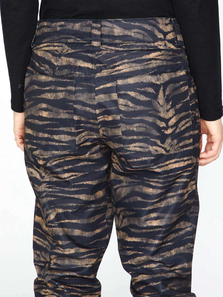 Volcom Women's Hallen Shell Pant 2023 - A pair of black and tan zebra-striped pants with a high waist, zip fly, and two back pockets.