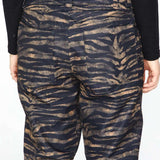 Volcom Women's Hallen Shell Pant 2023 - A pair of black and tan zebra-striped pants with a high waist, zip fly, and two back pockets.