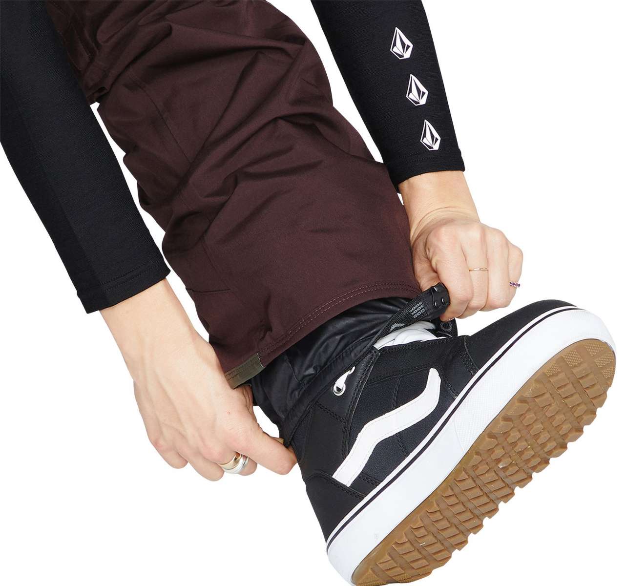 Volcom Women's Knox Insulated GORE-TEX Pant - A pair of brown ski pants with a white logo on the left thigh and a zipper pocket on the right thigh.