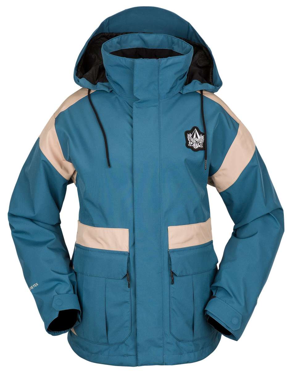 Volcom Women's Melancon GORE-TEX Jacket - A blue and tan jacket with a hood, featuring a black patch on the left chest area.