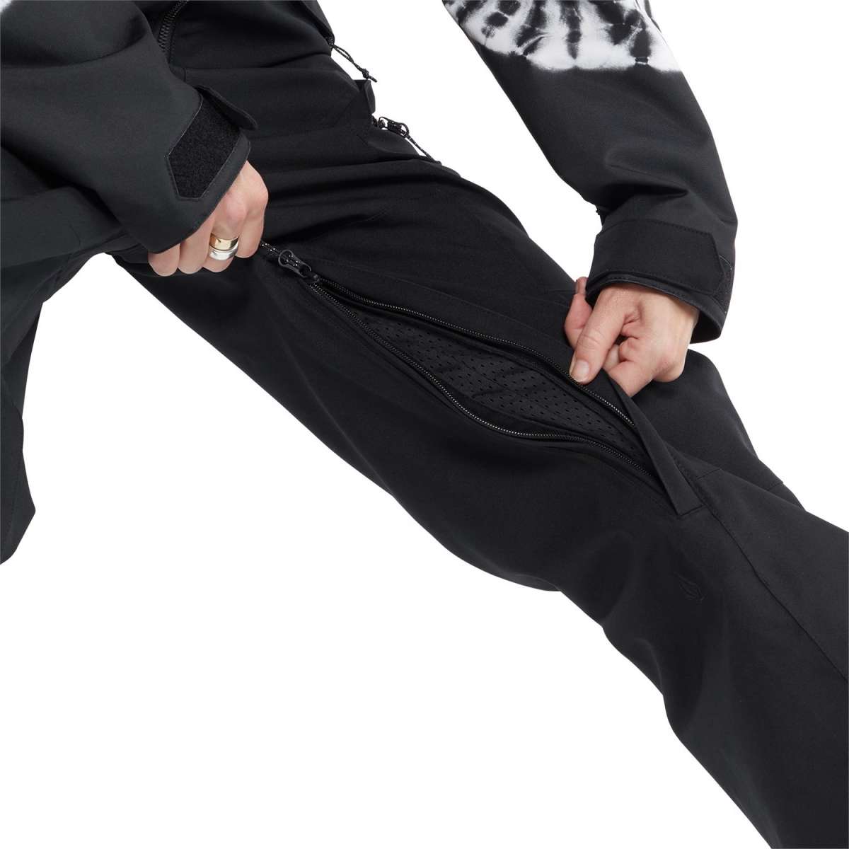 Volcom Women's Shiloh Snow Suit 2024 - Black snowsuit with white tie-dye pattern on chest and sleeves, zippered pockets, and adjustable cuffs.