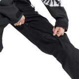 Volcom Women's Shiloh Snow Suit 2024 - Black snowsuit with white tie-dye pattern on chest and sleeves, zippered pockets, and adjustable cuffs.