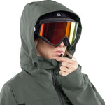 Volcom Women's Shiloh Snow Suit 2024 - A dark green snow suit with a black zipper and two zippered pockets on the front.