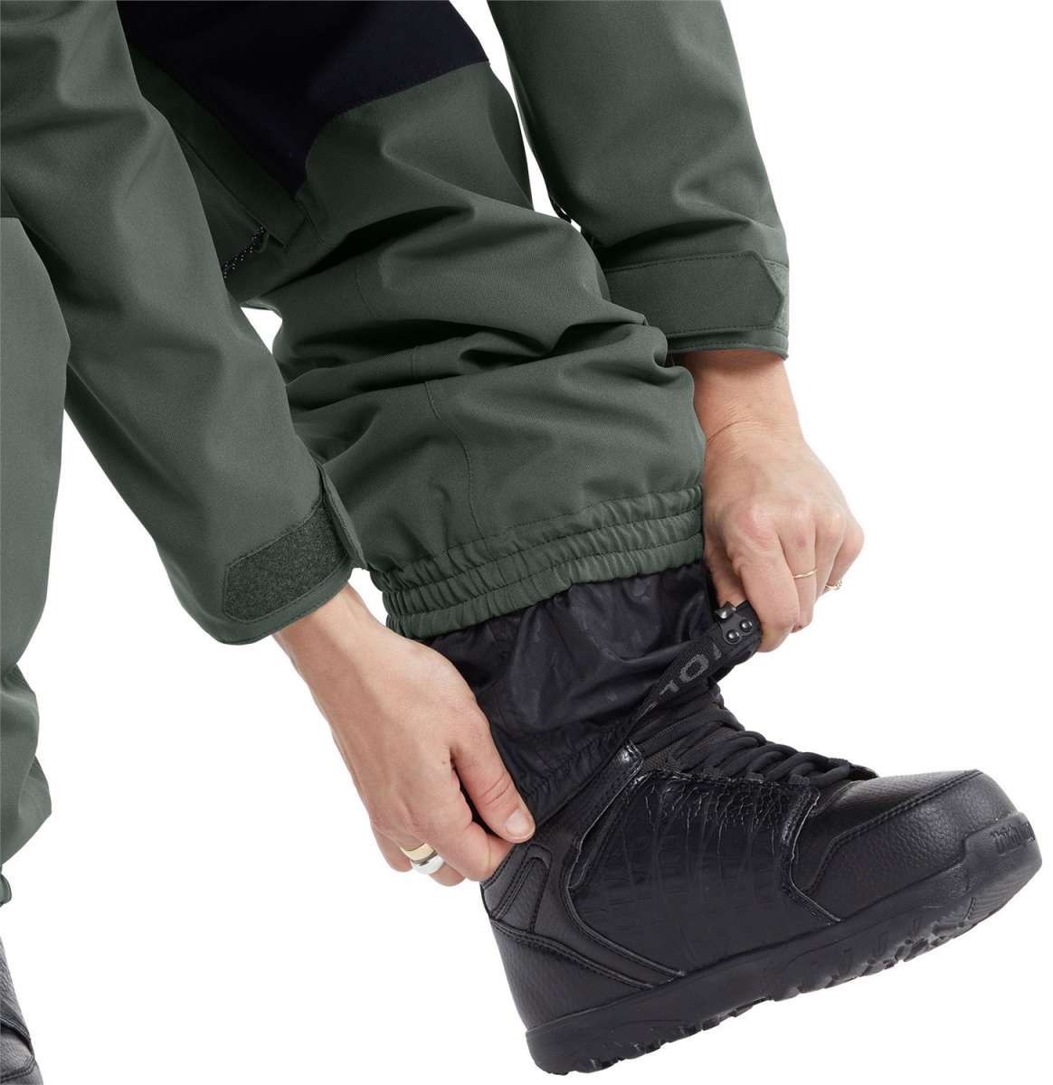 Volcom Women's Shiloh Snow Suit 2024 - A dark green snowsuit with a black zipper and white logo on the left chest.