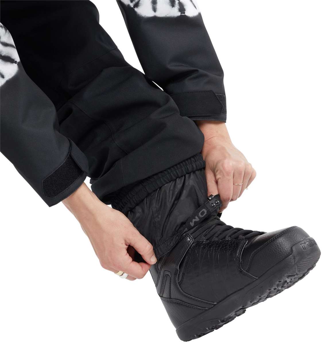 Volcom Women's Shiloh Snow Suit - A black snowsuit with a white tie-dye pattern on the upper arms and shoulders.