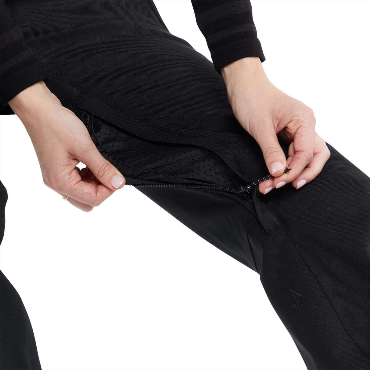 Volcom Women's Species Stretch Pant 2024 - Black pants with a subtle pattern of small, darker dots on the upper thigh area.