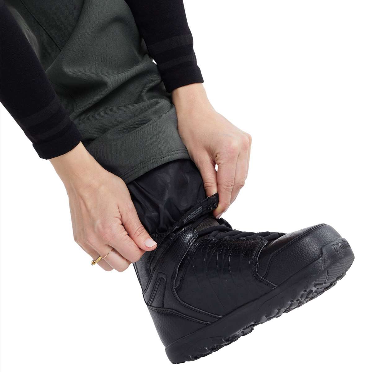 Volcom Women's Species Stretch Pant 2024 - A pair of black pants with a subtle patterned design on the upper thigh area.