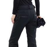 Volcom Women's Species Stretch Pant - Black pants with a subtle geometric pattern on the upper thigh area.