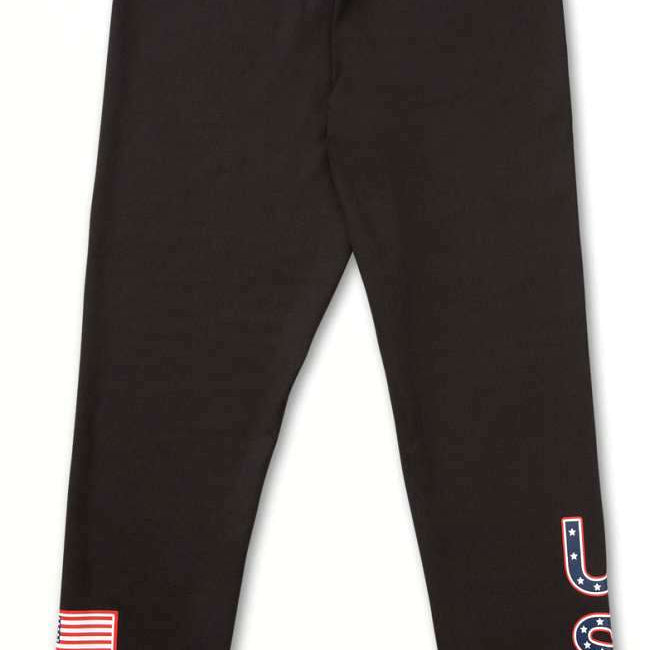 Volcom Women's USA Bottom Base - A pair of black leggings with a white outline of the United States on the left thigh and "USA" in blue letters outlined in red on the right leg.