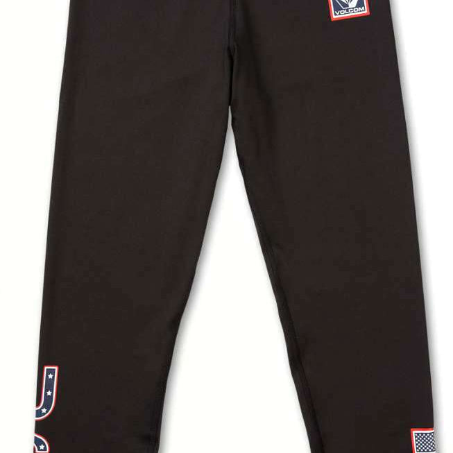 Volcom Women's USA Bottom Base 2022 - A pair of black leggings with a white "USA" logo on the left leg and a small American flag patch near the bottom hem.