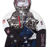 Volcom Women's USST Brighton Pullover Jacket 2022 - A black and white pullover jacket with a hood, featuring an all-over pattern of various images including people skiing and snowboarding.
