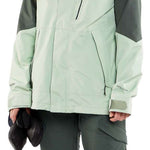 Volcom Women's V.Co Aris Insulated GORE-TEX Jacket 2024 - A light green jacket with a hood and black zipper on chest.