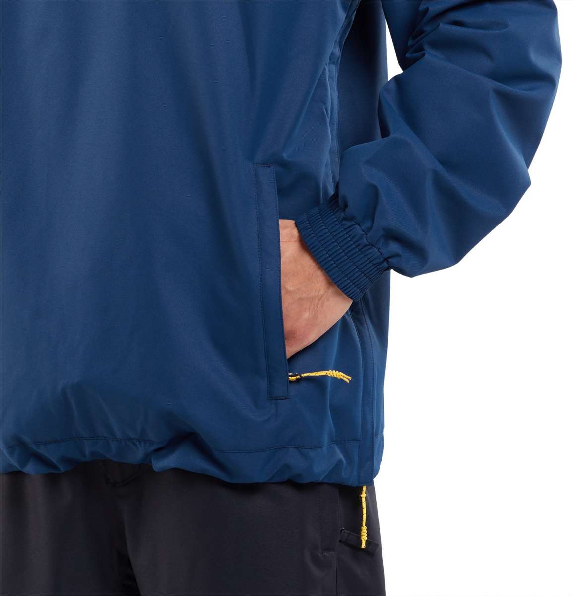 Volcom Longo Shell Pullover Jacket 2024 - A navy blue jacket with a zippered chest pocket and yellow zipper pull.