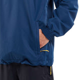 Volcom Longo Shell Pullover Jacket 2024 - A navy blue jacket with a zippered chest pocket and yellow zipper pull.