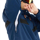 Volcom Longo Shell Pullover Jacket - A navy blue jacket with a white logo on the left chest and black accents around the shoulders, collar, and zipper.