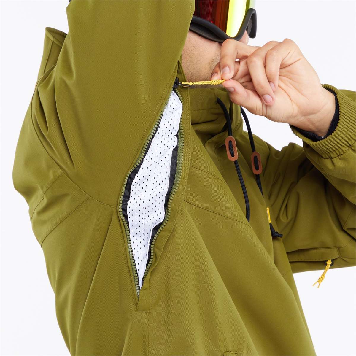 Volcom Longo Shell Pullover Jacket - A green jacket with a hood, featuring a zipper and two pockets on either side.