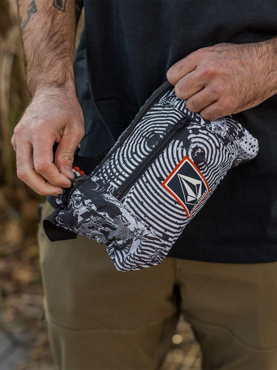 Volcom Pack It USA GORE-TEX Jacket 2022 - A black and white jacket with a red stripe on the sleeve, featuring a zipper closure.