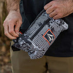 Volcom Pack It USA GORE-TEX Jacket 2022 - A black and white jacket with a red stripe on the sleeve, featuring a zipper closure.