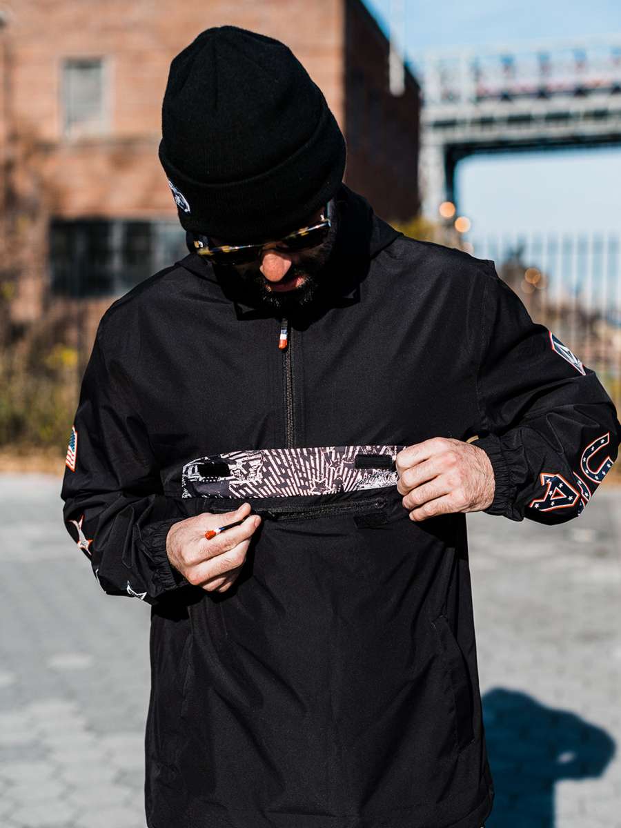 Volcom Pack It USA GORE-TEX Jacket 2022 - A black jacket with a white American flag patch on the left sleeve and a small logo on the right chest.