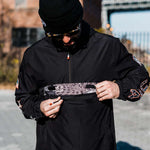 Volcom Pack It USA GORE-TEX Jacket 2022 - A black jacket with a white American flag patch on the left sleeve and a small logo on the right chest.