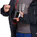 Volcom TDS 2L GORE-TEX Insulated Jacket 2023 - A black jacket with white lettering and a red lining visible inside the open zipper pocket on the left side.
