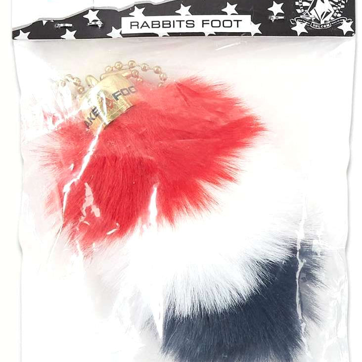 Volcom USA Lucky Faux Rabbit Foot 2022 - Red, white and blue faux fur foot with gold beads on top.