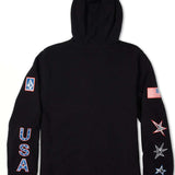 Volcom USA Polartec Fleece 2022 - A black fleece pullover with a small American flag patch on the left sleeve and a blue, white, and red "USA" logo on the chest.