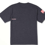 Volcom USA Stone Short Sleeve Tee 2022 - A dark gray t-shirt with a small red and white striped American flag on the left sleeve.